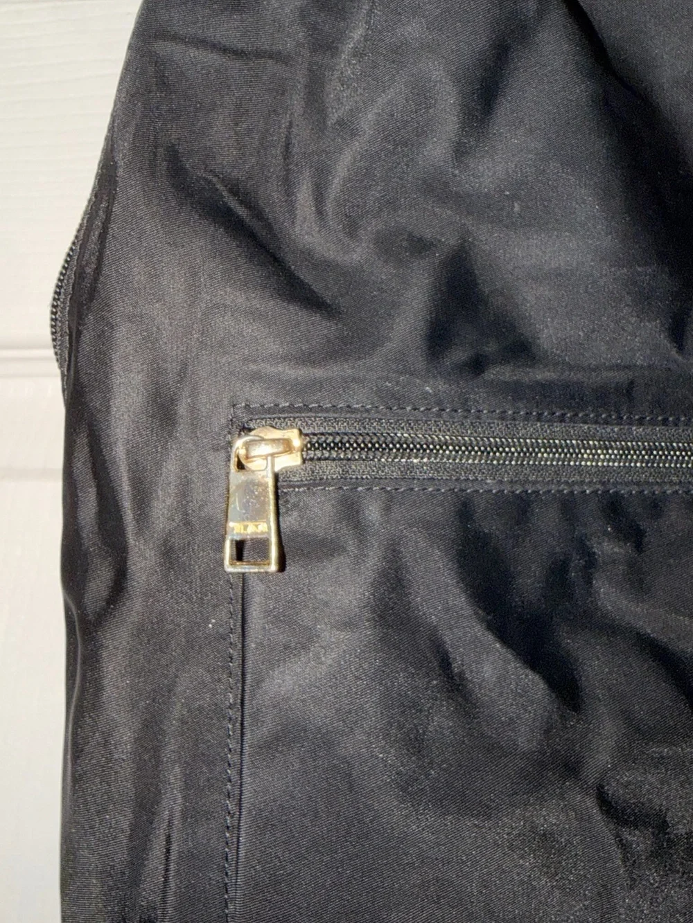 Tumi Black Nylon Backpack with Gold-Tone Hardware